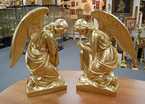 Pair gold painted kneeling - of,